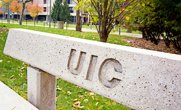 Stone bench with UIC engraved on back.